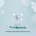 Close-up of a silver necklace with a detailed butterfly pendant on an O-ring chain.