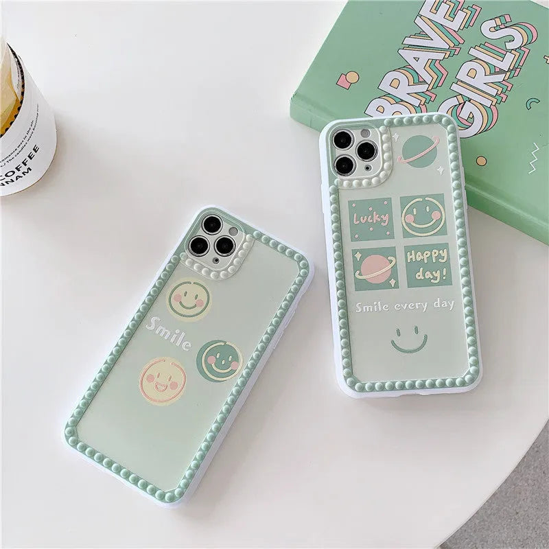 Geometric smiley face TPU iPhone case with polka dot frame on iPhone