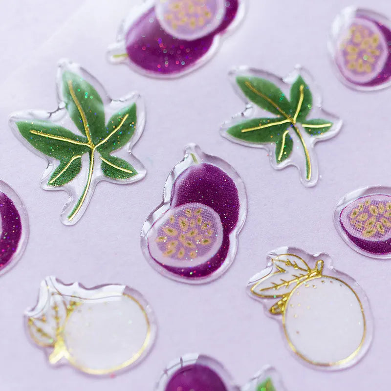 Sheet of DIY metallic gold fruit stickers including grape, orange, passion fruit, peach, pineapple, and strawberry designs.