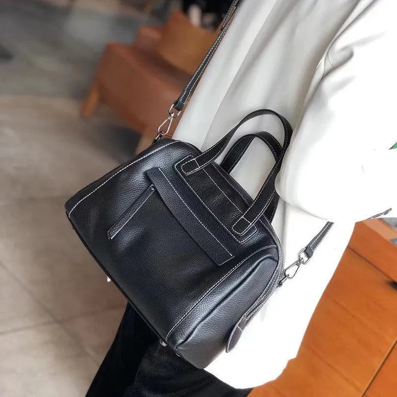 Genuine leather shoulder messenger bag with lychee pattern texture in horizontal square shape showing interior organisation compartments