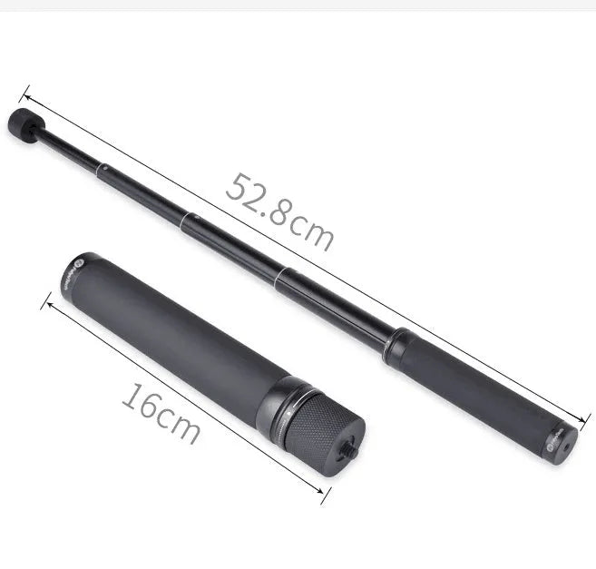 Black retractable aluminium selfie stick extended to full length with a smartphone attached in the clamp.