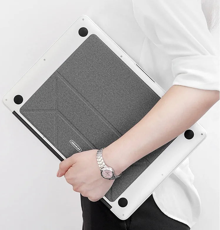 Blue or grey portable foldable laptop cooling stand bracket with anti-slip pads on a flat surface.