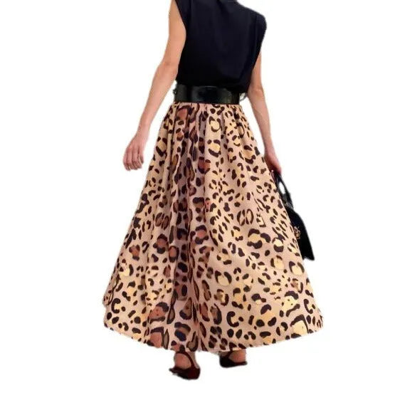 Brown leopard print women's A-line long skirt with a large hem, shown on a hanger.