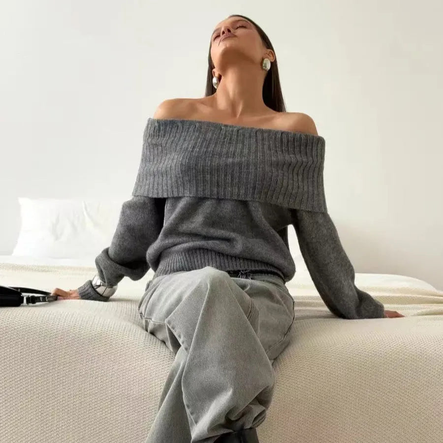Grey off-the-shoulder sweater with a 3D textured pattern and regular sleeves on a model.