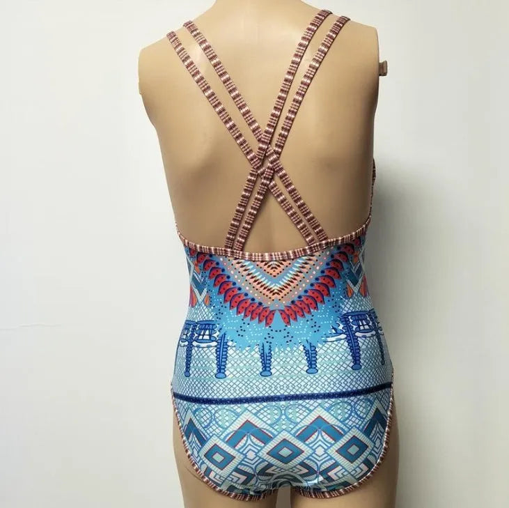 Women's one-piece swimsuit with open back and floral pattern in polyester spandex blend