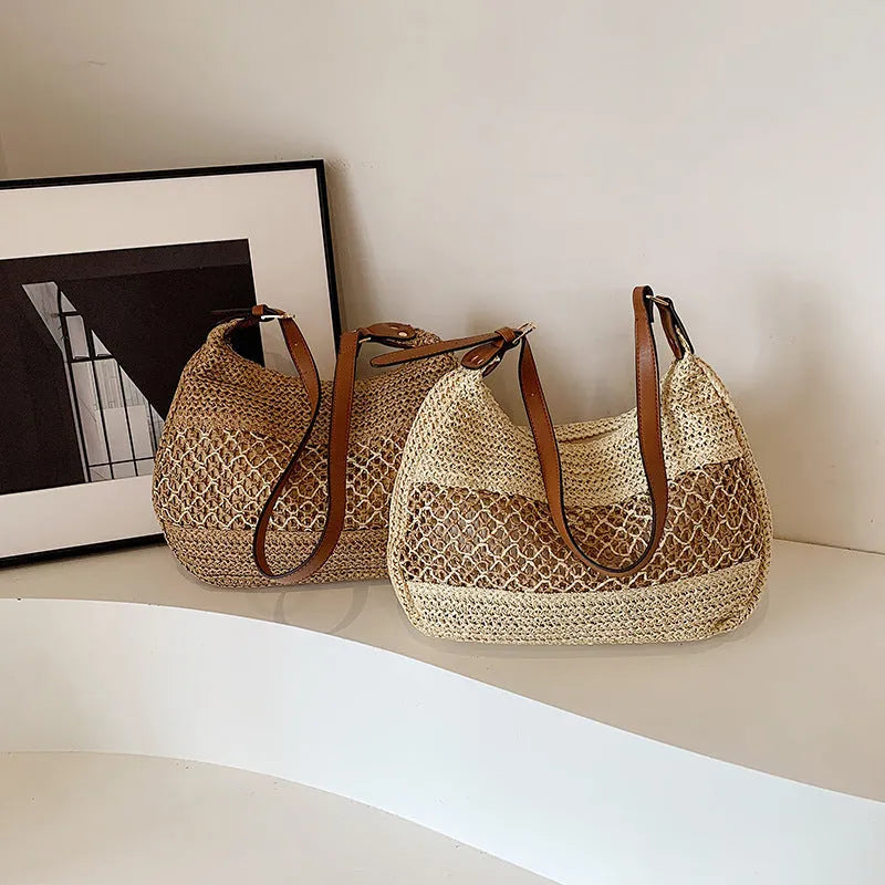 Khaki coloured straw cross body bag with a square shape and an external sandwich pocket.