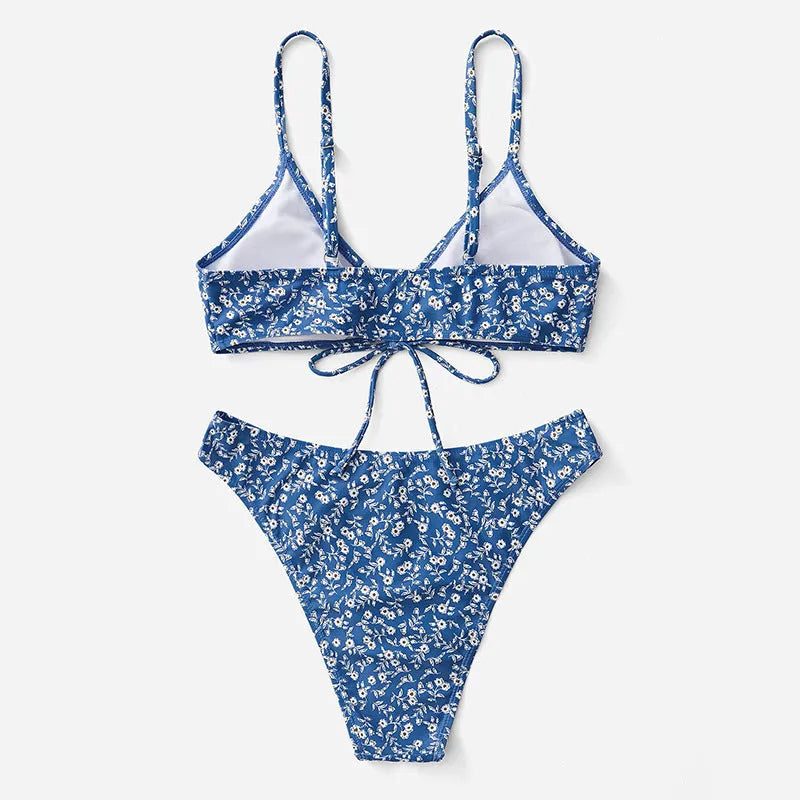 Blue polyester three-piece swimsuit set comprising a rash vest and matching shorts.