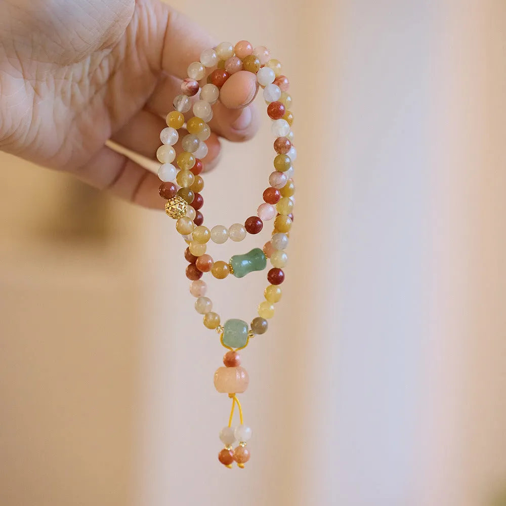Women's handcrafted three-circle pumpkin jade bracelet with gold tassels