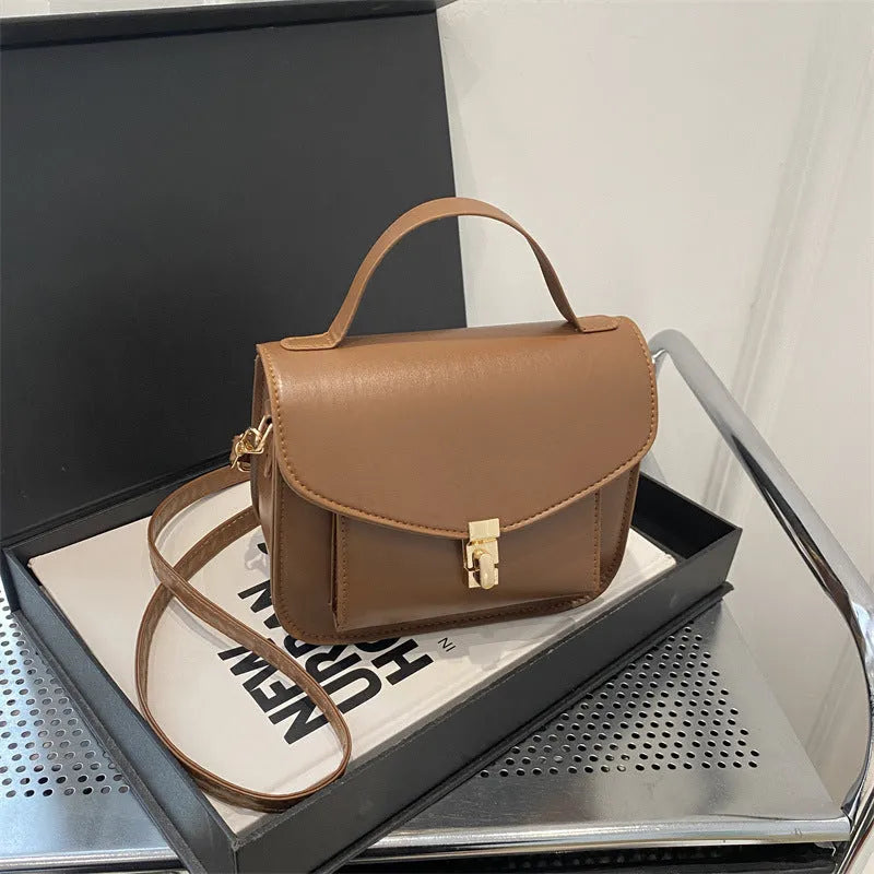 Horizontal square PU leather messenger bag showing document compartment and crossbody strap
