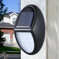 Black rectangular solar-powered LED wall light for outdoor automatic lighting.
