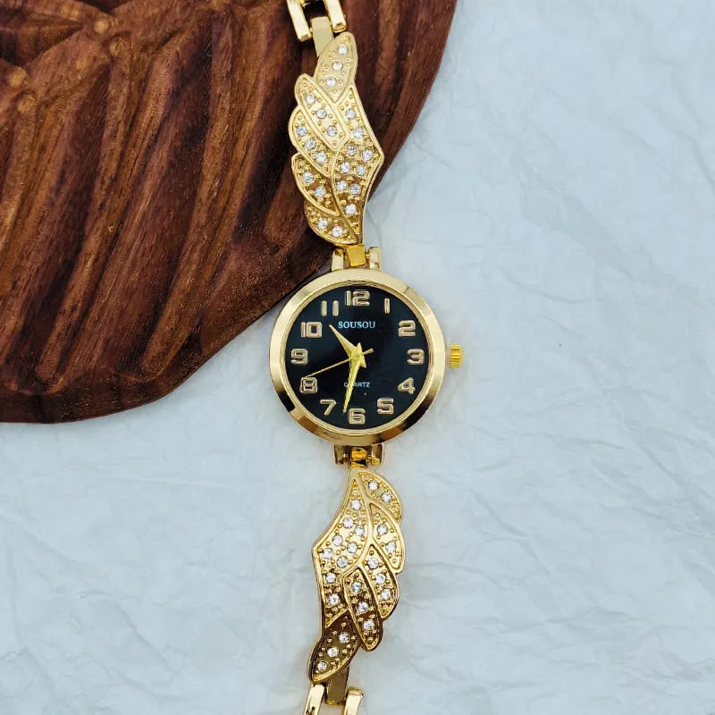 Stainless steel women's watch with round dial and Vachette clasp in gold, black and gold, or gold and white.