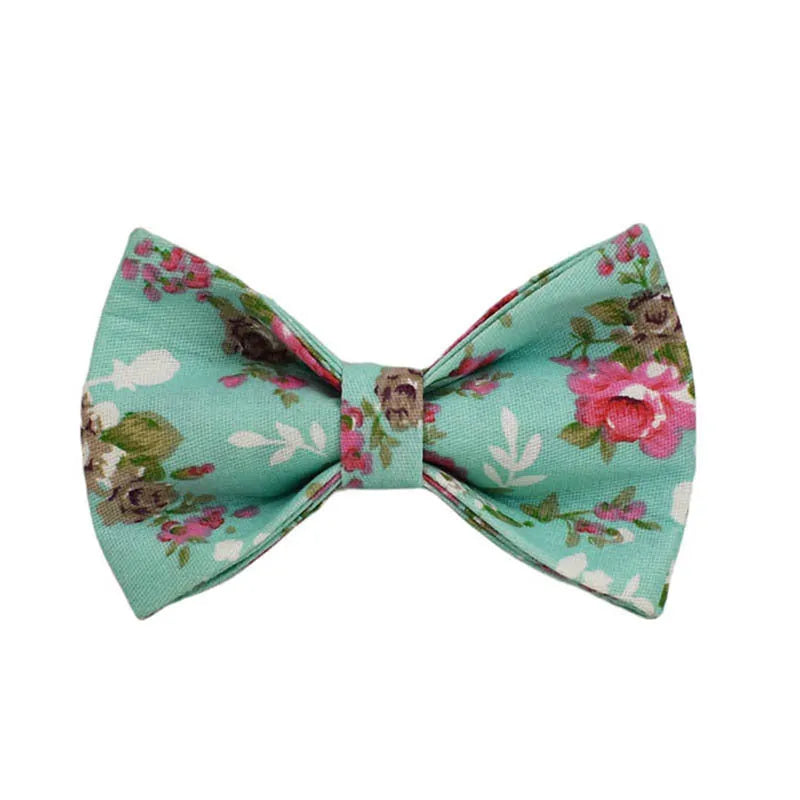 Rose patterned dog collar and leash set with green background, detachable bow, and matching cloth vest.