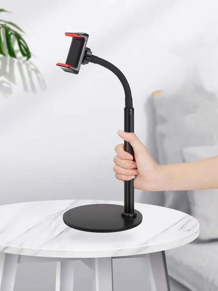 Lazy desktop stand holding a mobile phone on a desk, silicone tube and aluminium alloy construction