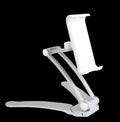 Silver aluminium alloy desktop stand holding a tablet at an angle, with adjustable clips and a white mounting base.