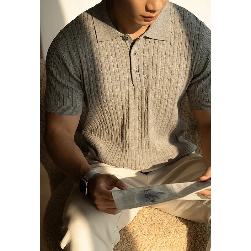 Men's khaki short sleeve business casual top on a hanger