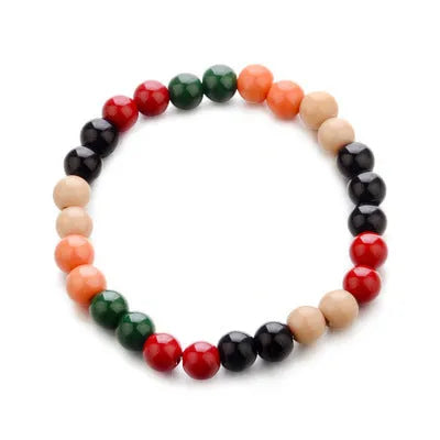 Natural stone bead bracelet with lava stones on wrist, showing ethnic unisex design.