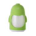 Penguin car humidifier with blue body, USB cable, and mist coming from the top