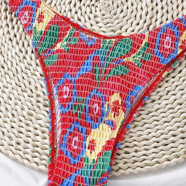Red floral underwire bikini top and briefs on a white background.
