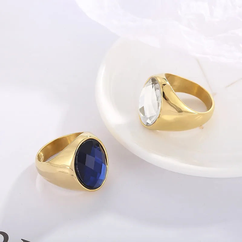 Stainless steel geometric oval ring for women with retro electroplated finish on plain background