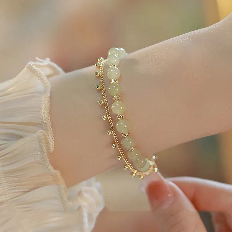 Natural Hetian jade beaded bracelet in classic princess running style for women.