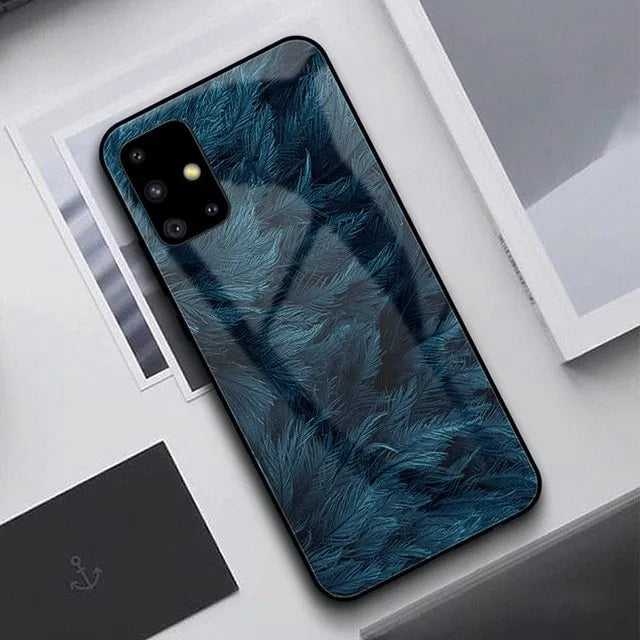 Simple black silicone phone case shown next to a navy blue version, for Samsung and iPhone models.