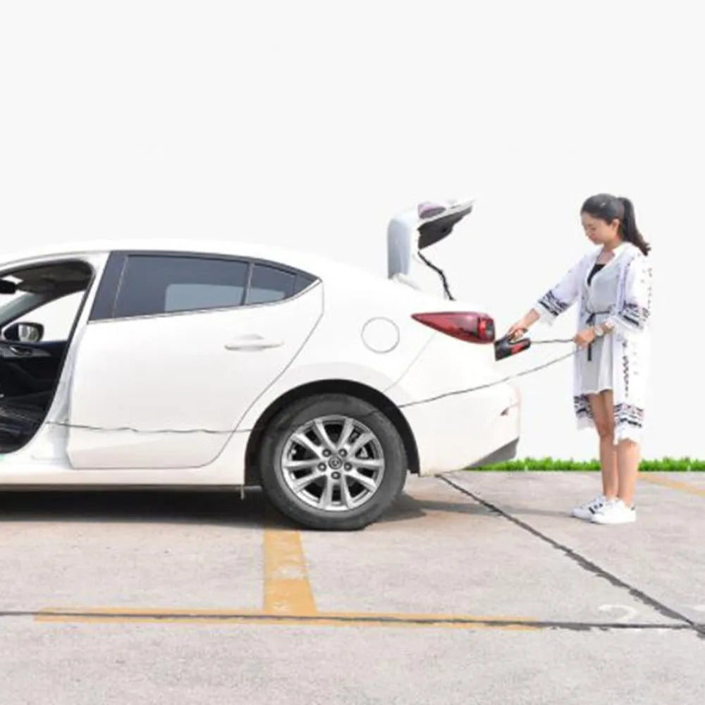 Handheld high-power 120W car vacuum cleaner with brush and long nozzle on black background