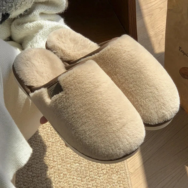 Blue unisex winter plush PVC house slippers with car stitching and a non-slip sole.