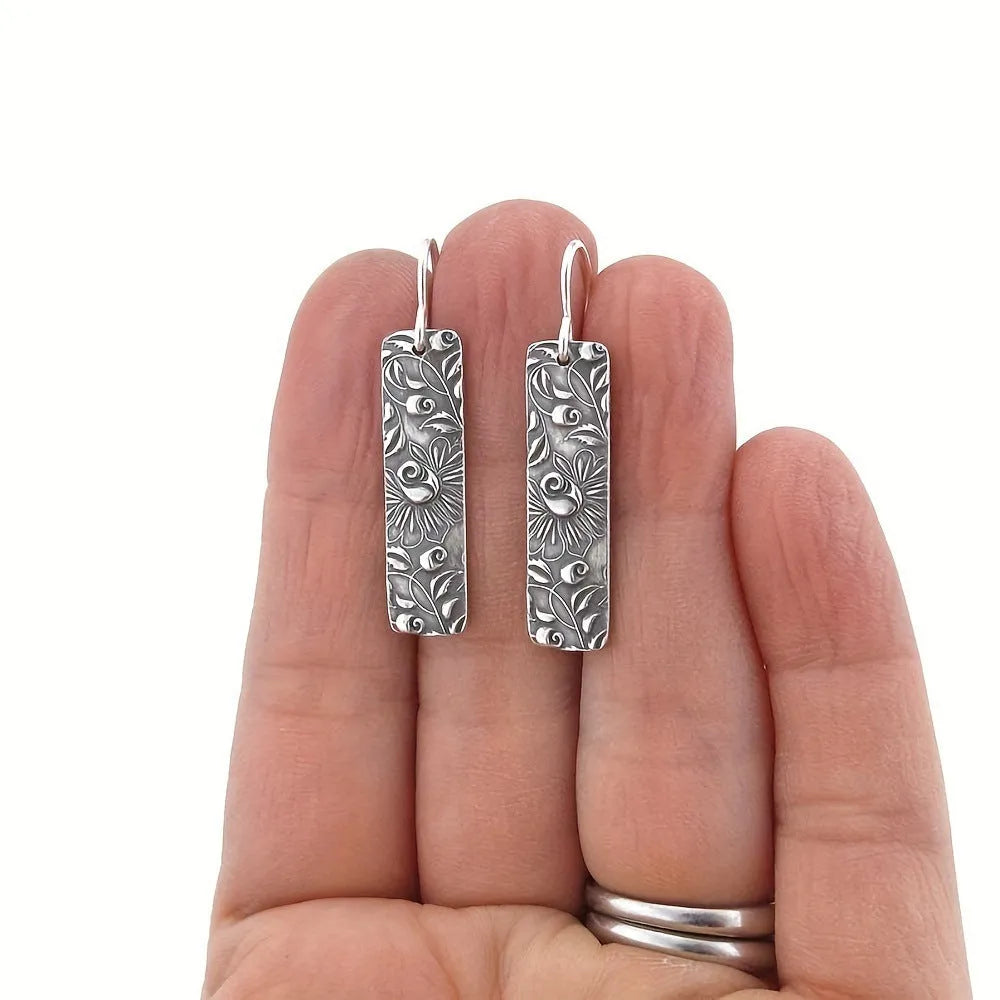 Silver geometric long earrings with carved vine patterns on zinc alloy