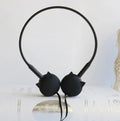 Cute black cat-shaped wired earphones with 3.5mm plug next to blue, pink, and white colour options.