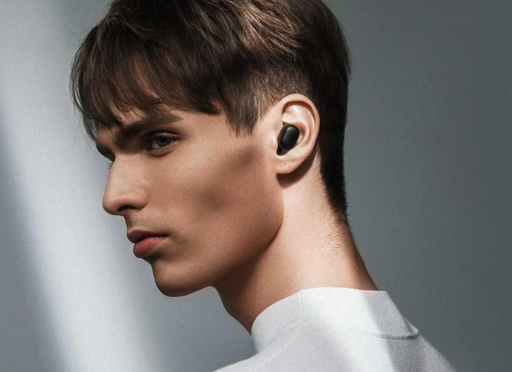 Redmi AirDots 2 black true wireless earbuds and charging case on a white background.