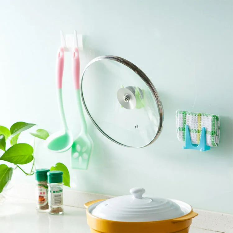 Wall-mounted PP plastic kitchen lid holder in blue, green or white, stuck inside a cabinet for lids and utensils.