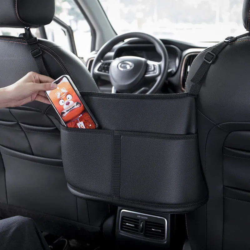 Black leather car seat net pocket storage bag with sports carbon fibre pattern.