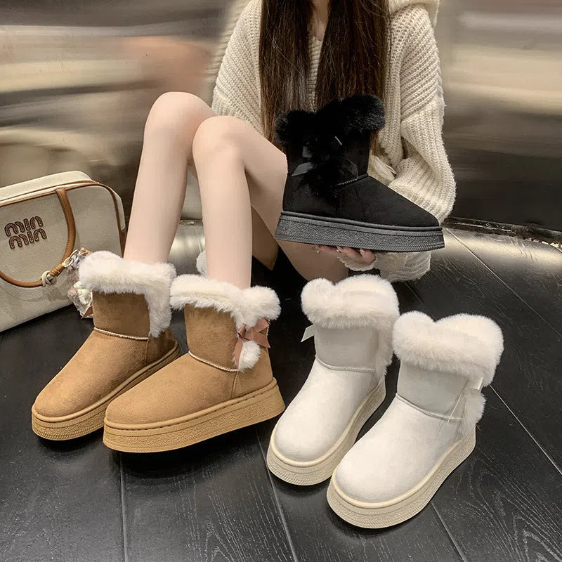 Women's mid-calf suede snow boots with faux fur lining, 1–3 cm thick rubber sole, and bow tie detail, shown in brown, black, or white.