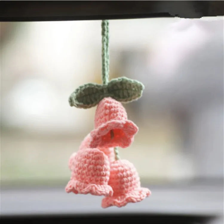 Green and white knitted wool plant ornament for car dashboard with hanging cord