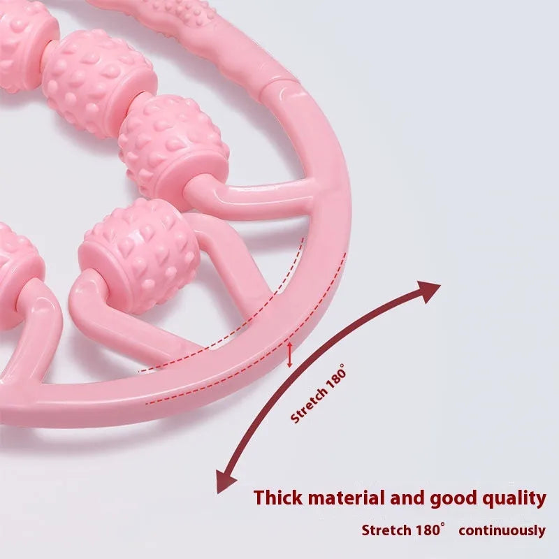 Handheld leg massager roller with multiple wheels in pink or purple on a table.