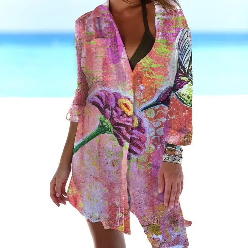 Women's long sleeve polyester cardigan with a colourful 3D bird and flower digital print, shown as a beach cover-up.