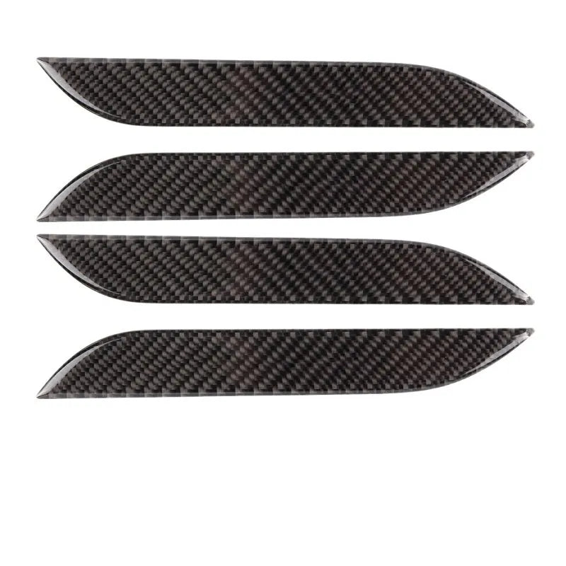 Four clear carbon fibre adhesive door handle protection patches for Tesla Model S interior.