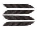 Four clear carbon fibre adhesive door handle protection patches for Tesla Model S interior.