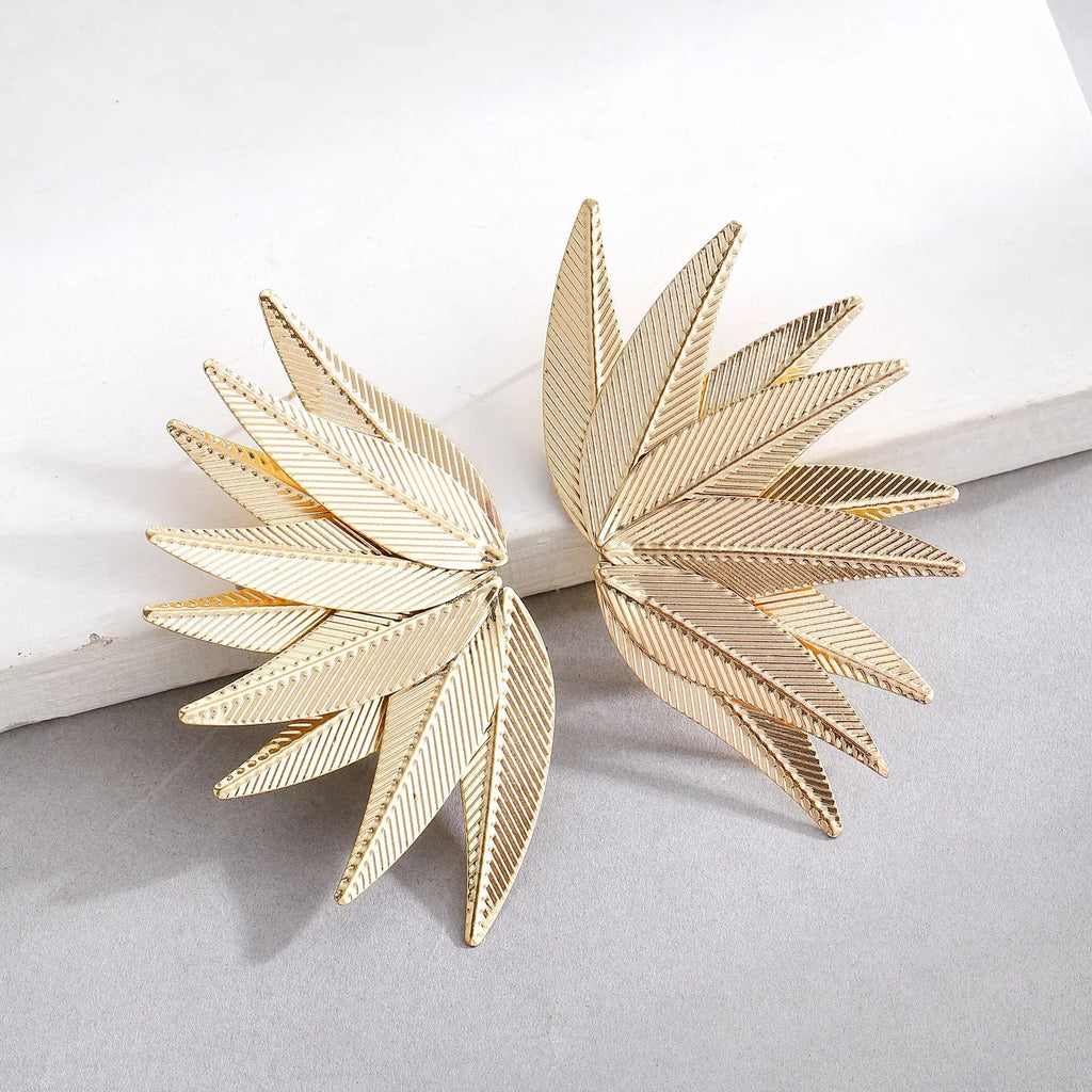 Alloy metal leaf-shaped patch earrings in white and gold colour options