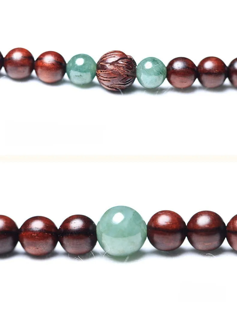 Rosewood bead bracelet with 108 beads and a carved green Hotian jade pendant.