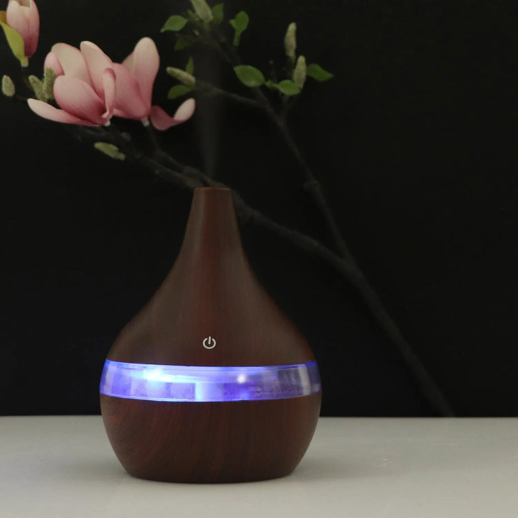 USB mini desktop air purifier and humidifier in wood grain finish for small rooms.