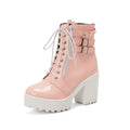 Women's black thick-heel ankle boots with lace-up front and round toe on a rubber sole.