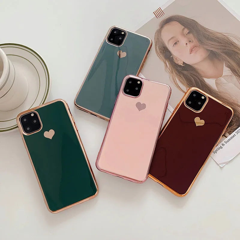 Solid colour TPU phone case for iPhone shown in blue, claret, pink and green options.
