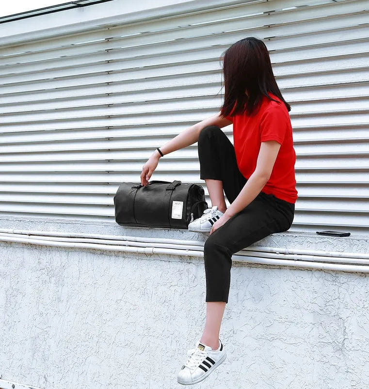 Black waterproof sports fitness bag with separate side compartments for shoes, shown in large and small sizes.
