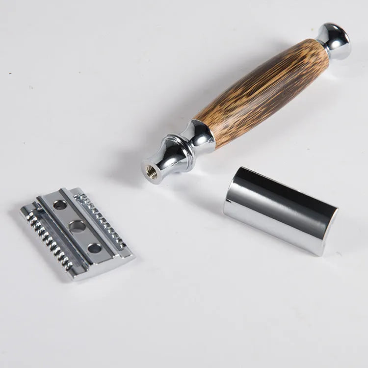 Natural bamboo handle double edged safety razor with silver metal head on light background
