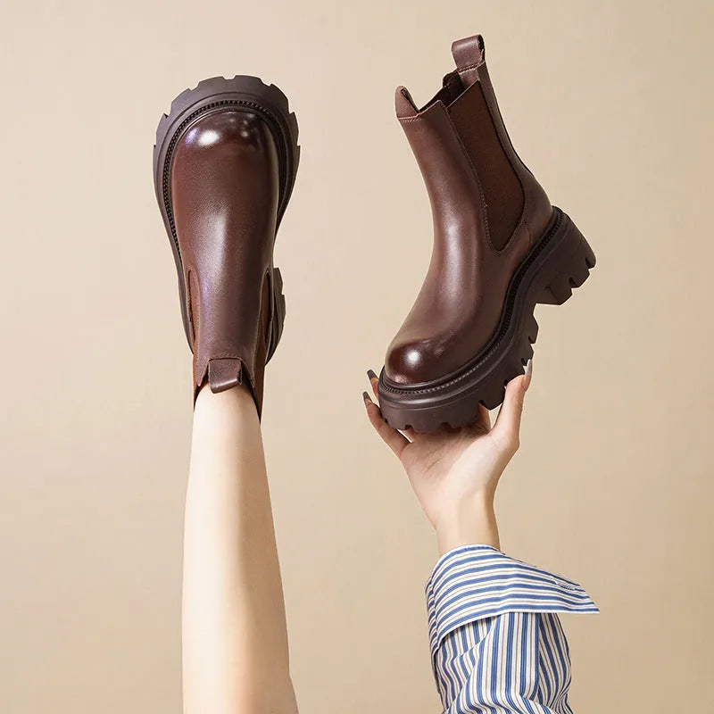 Women's brown brushed cowhide Martin boots with high horseshoe heel, round toe, and thick rubber sole
