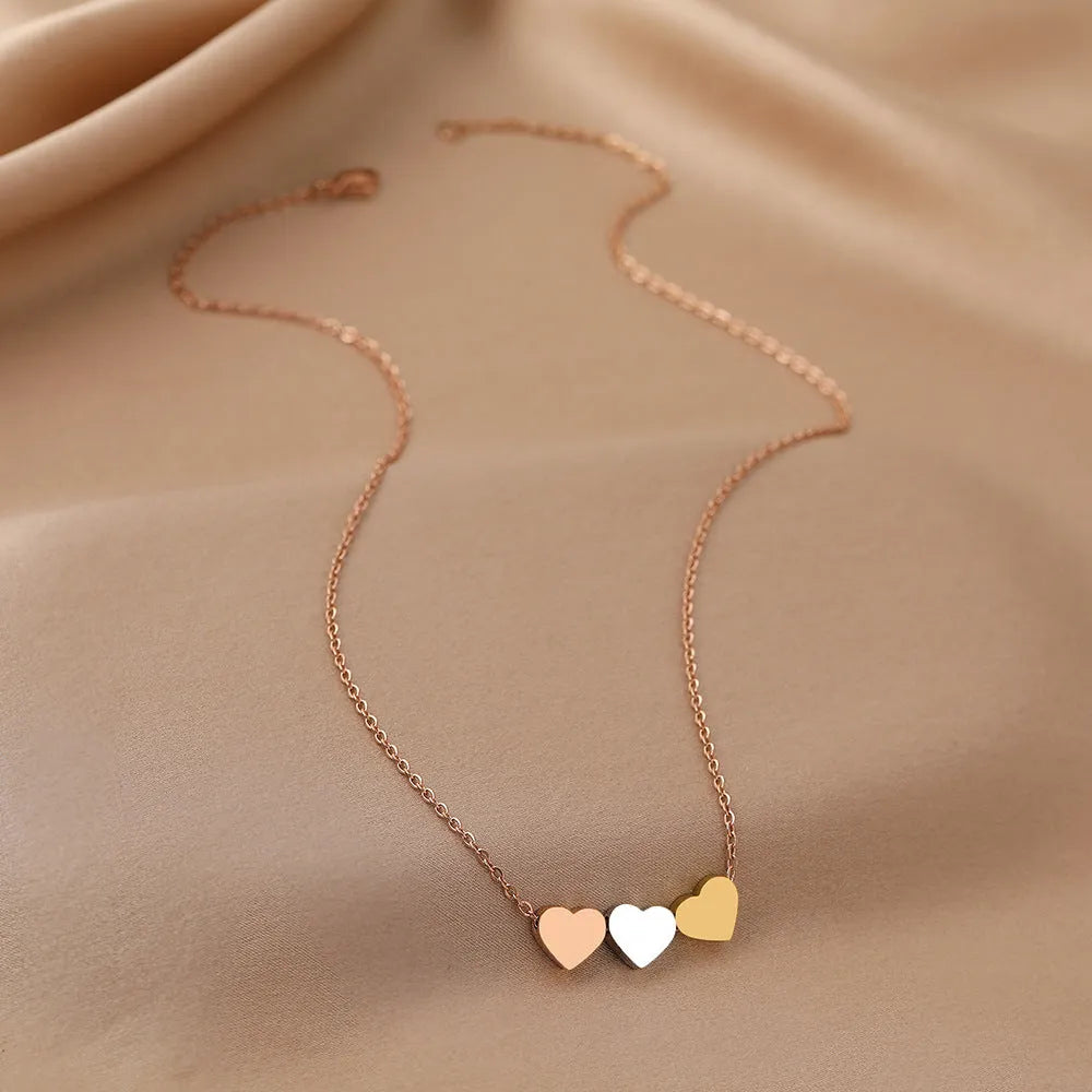 Mirror finish titanium steel heart pendant necklace in gold, rose gold, and steel colour options
