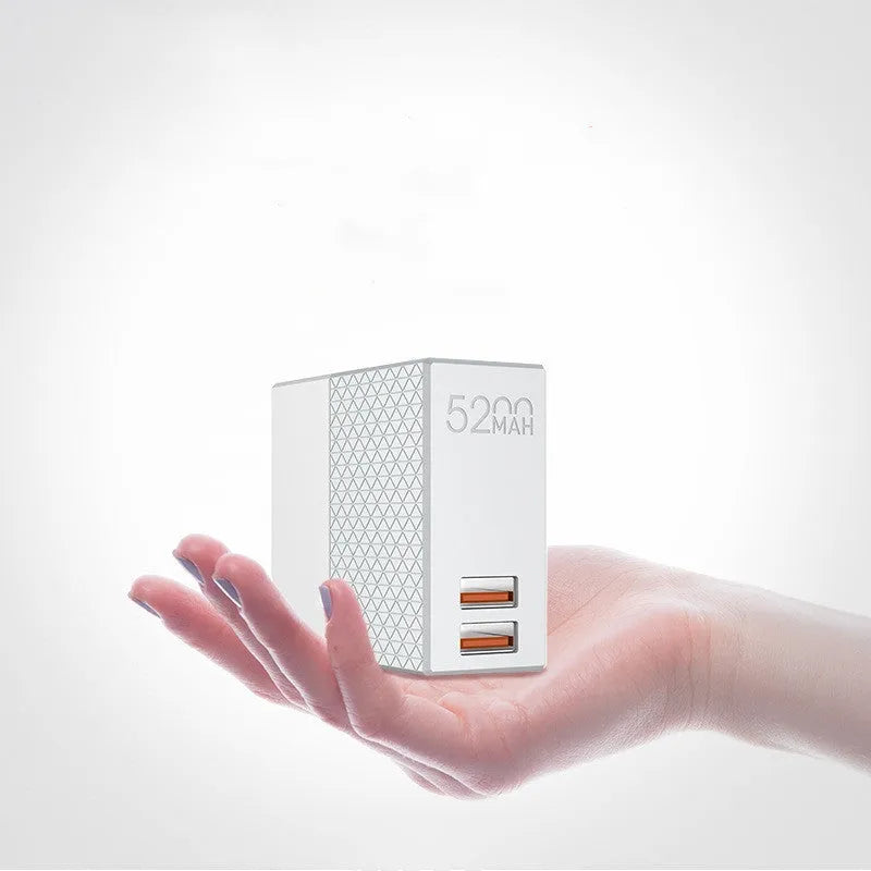 White two-in-one mobile power bank charger with built-in UK, EU, and US plug pins