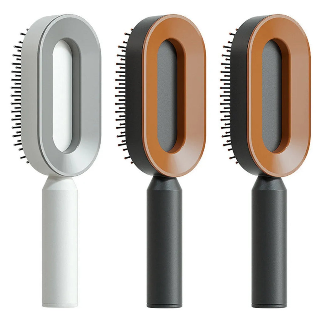 Self-cleaning air cushion hair brush in white, black gold, or black purple with ergonomic handle