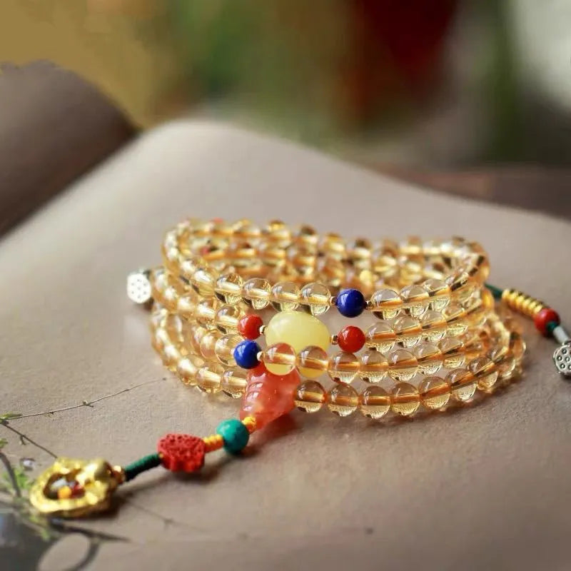 Yellow natural citrine beaded bracelet with 1mm beads on a filament strand.